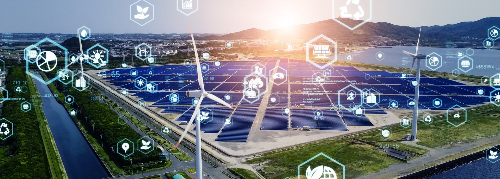 Icons aus dem Energiebereich vor einem Solargrid und Windrädern