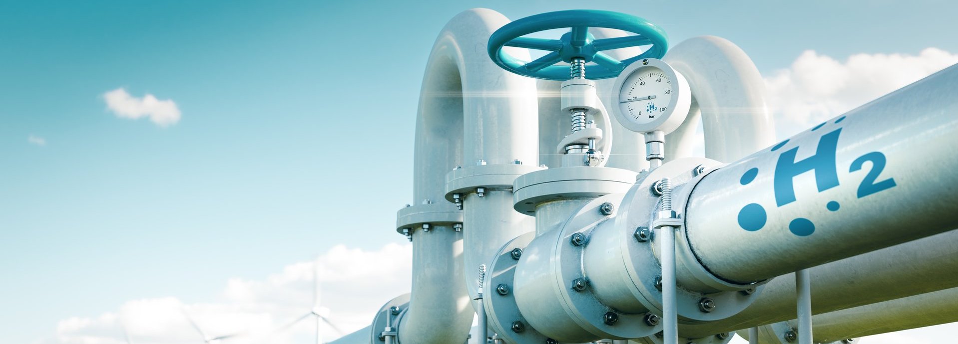 Beschreibung: Rohr mit Wasserstoff auf einer grünen Wiese und vor blauem Himmel
