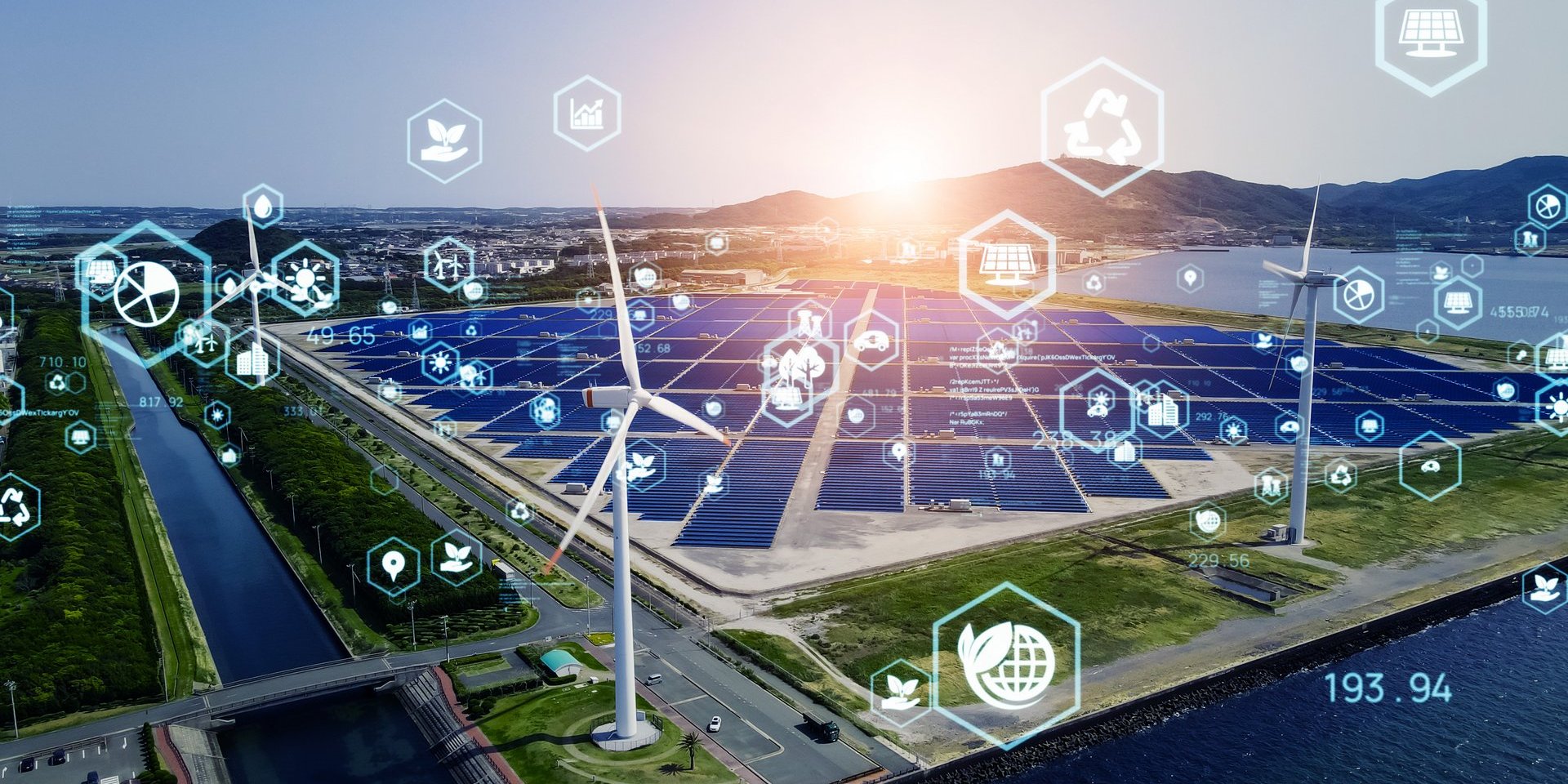 Icons aus dem Energiebereich vor einem Solargrid und Windrädern