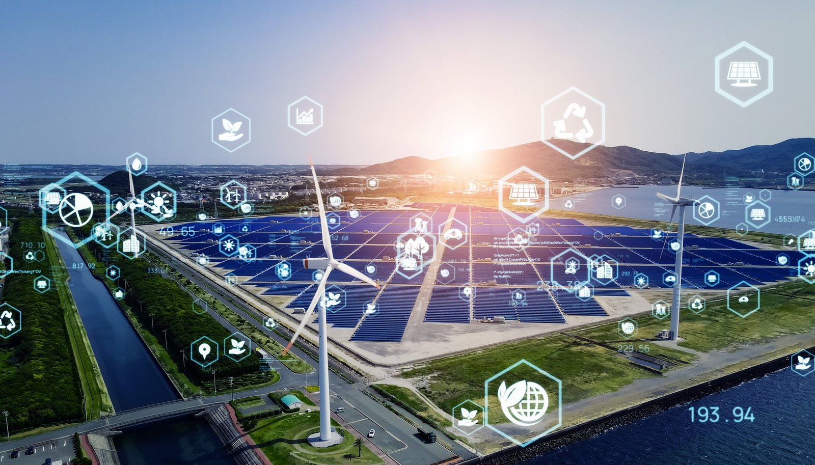 Icons aus dem Energiebereich vor einem Solargrid und Windrädern
